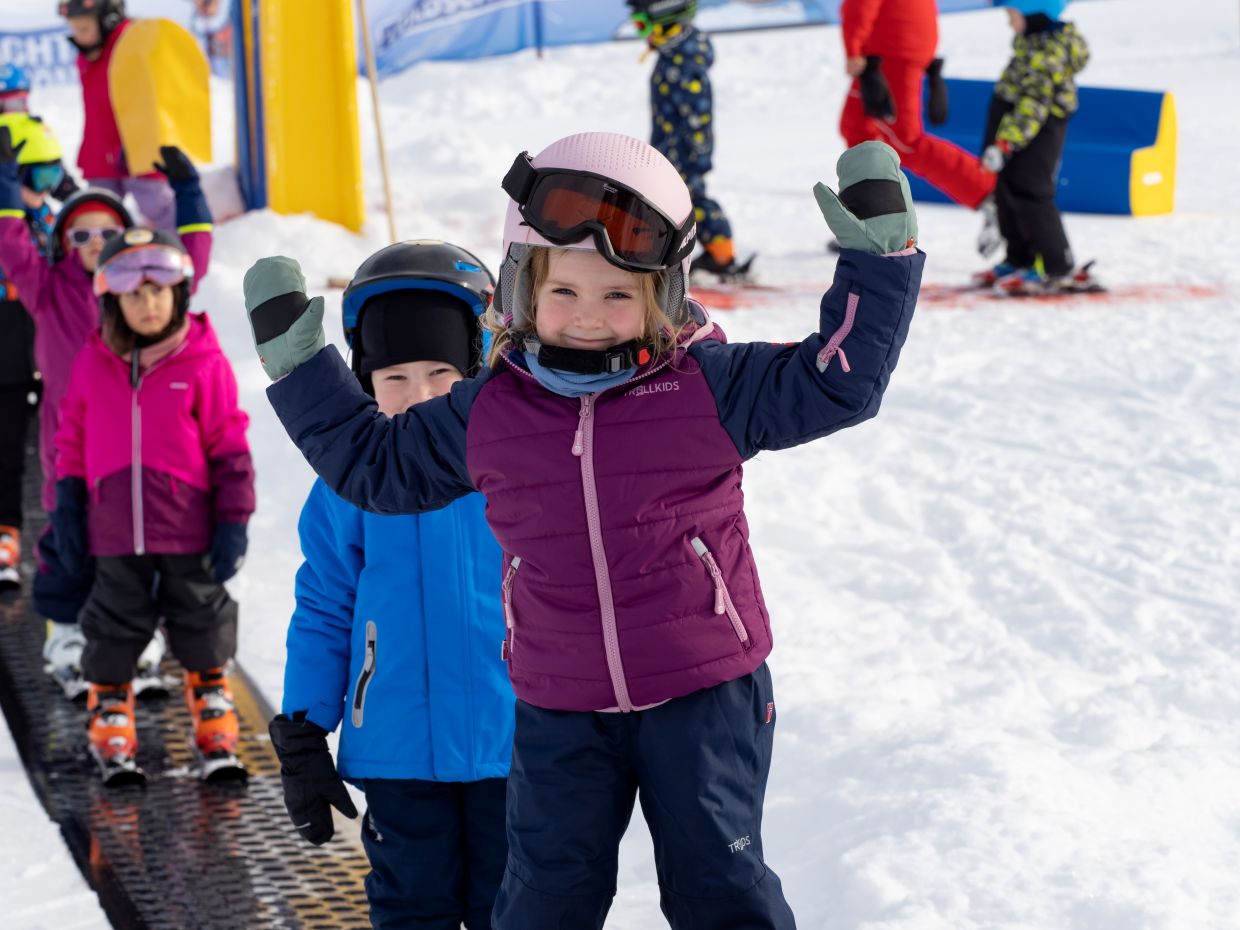 Happy children on the magic carpet at the Zwergenland on the Schatzberg