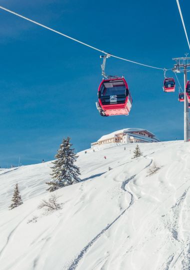 Schatzberg gondola cabins above the slope in Auffach